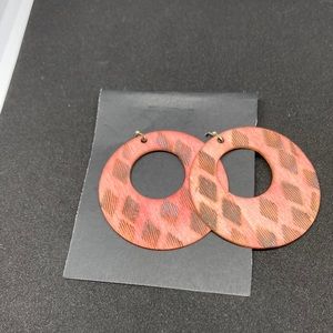 Woodburned disk earrings, red with black diamonds.
